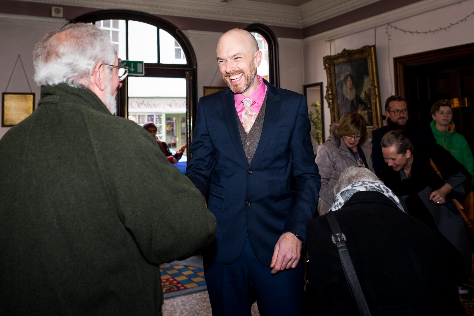 Mark greets guests in Lewes Town Hall before his wedding to Annie.