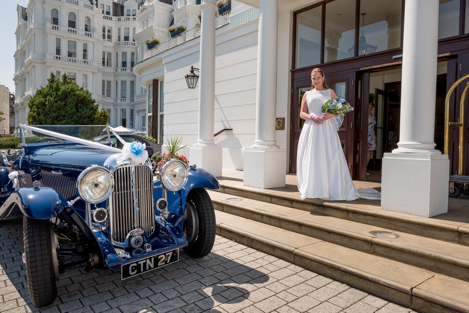 Donna is photographed with her wedding car.