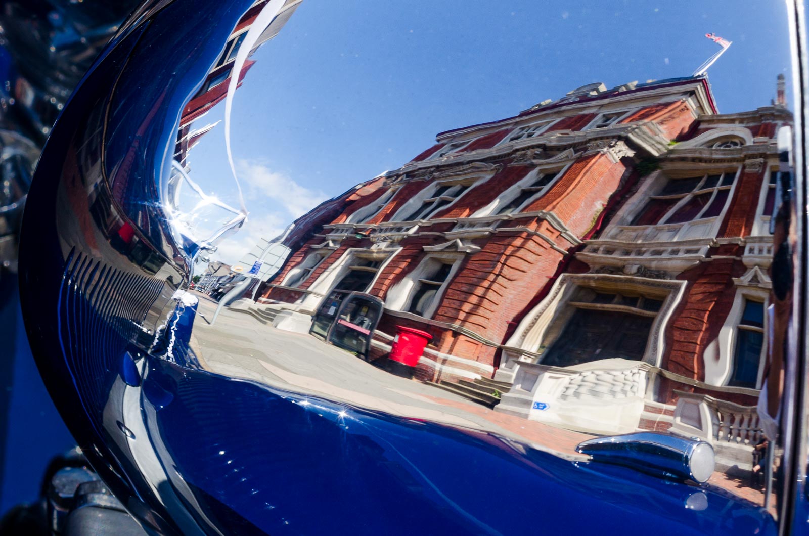 Eastbourne Town Hall is photographed in the reflection of Donna and Andy's Wedding Car.