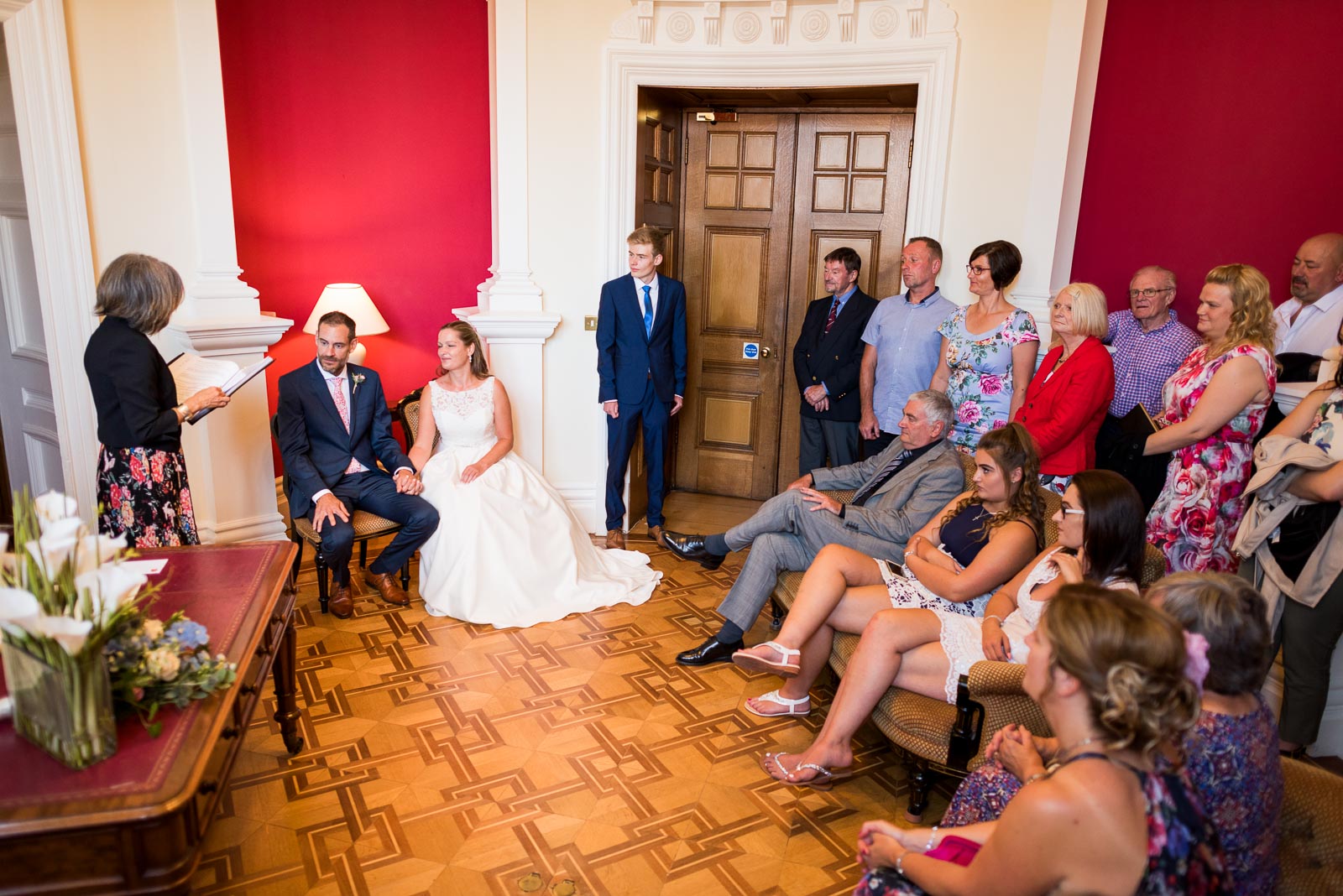Donna and Andy surrounded by guests at their wedding in Eastbourne Town Hall.