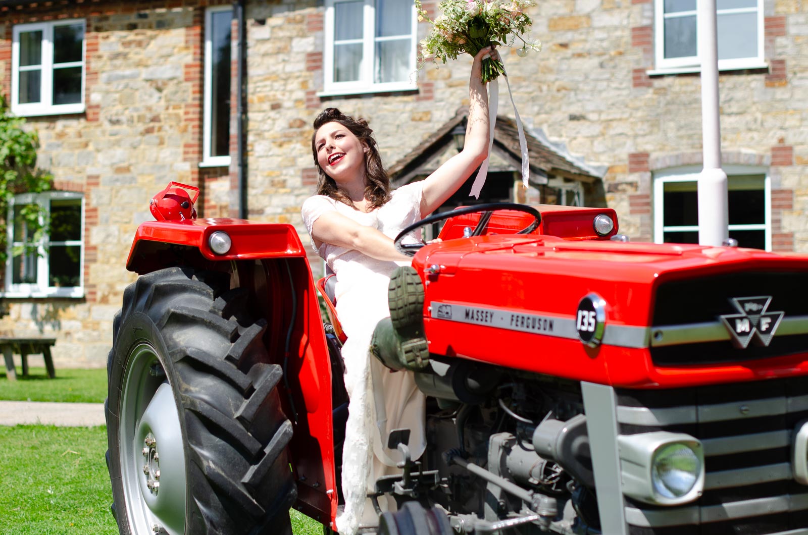 Toni poses on a tractor at Nutley Edge.