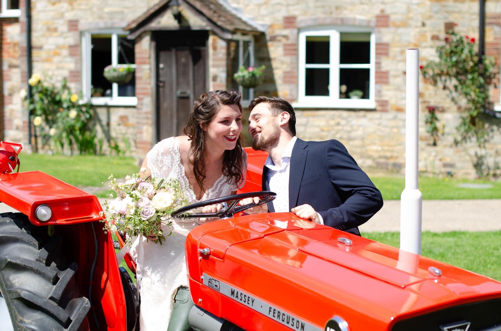 Lule give Toni a kiss on a tractor at Nutley Edge.