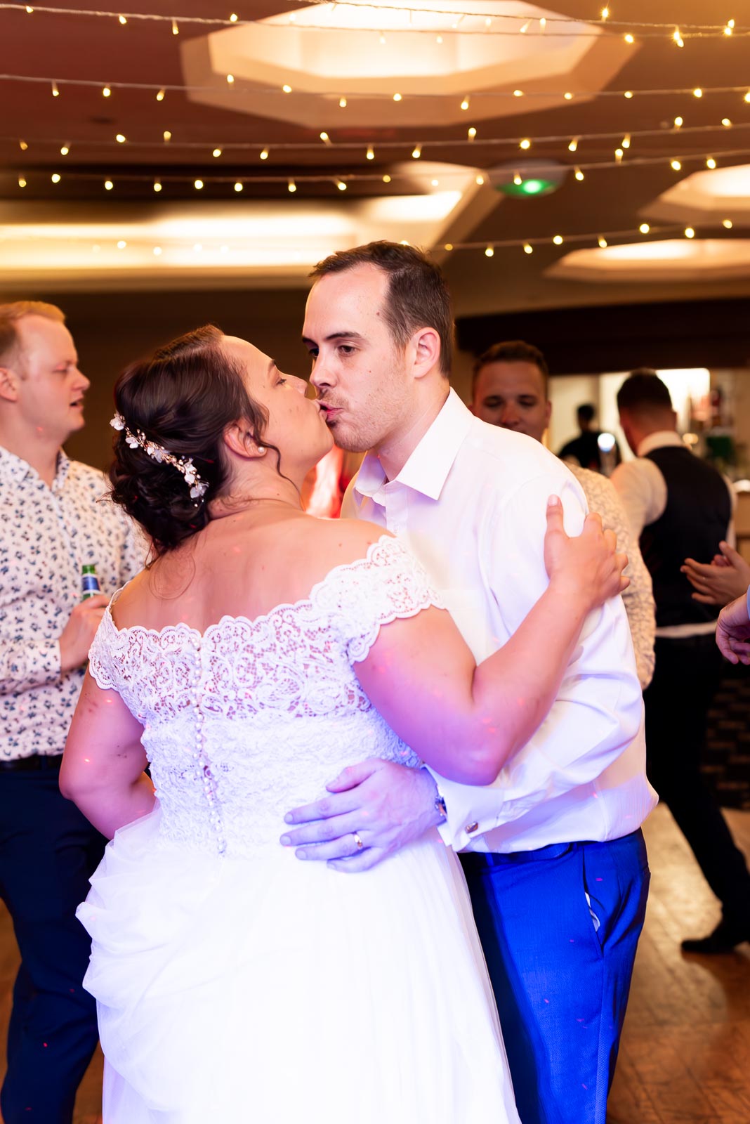Amy and James embrace during their first dance in the White Hart Hotel, Lewes.