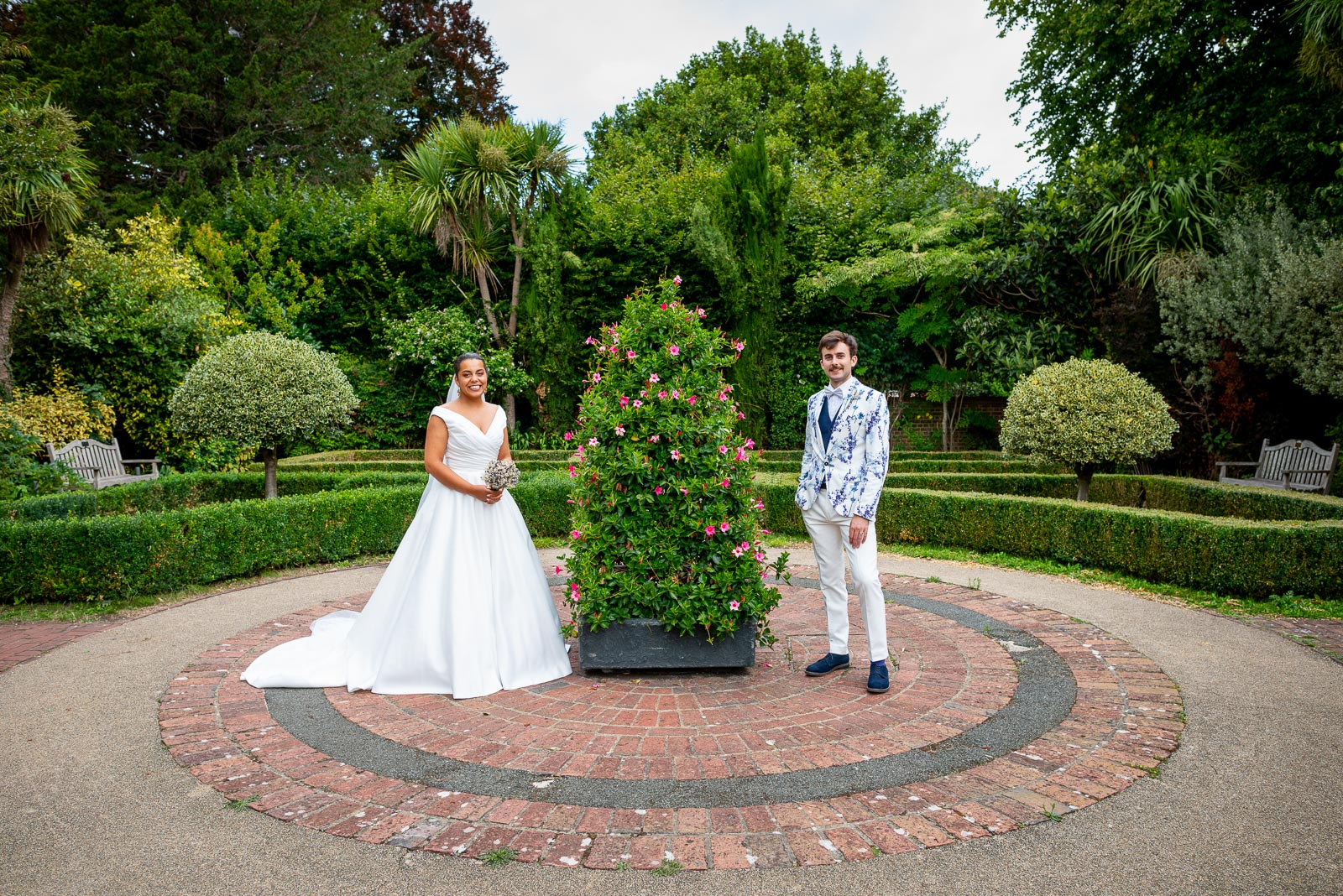 Olivia and Edward pose in the Secret Garden at Southover Grange in Lewes after their Wedding.