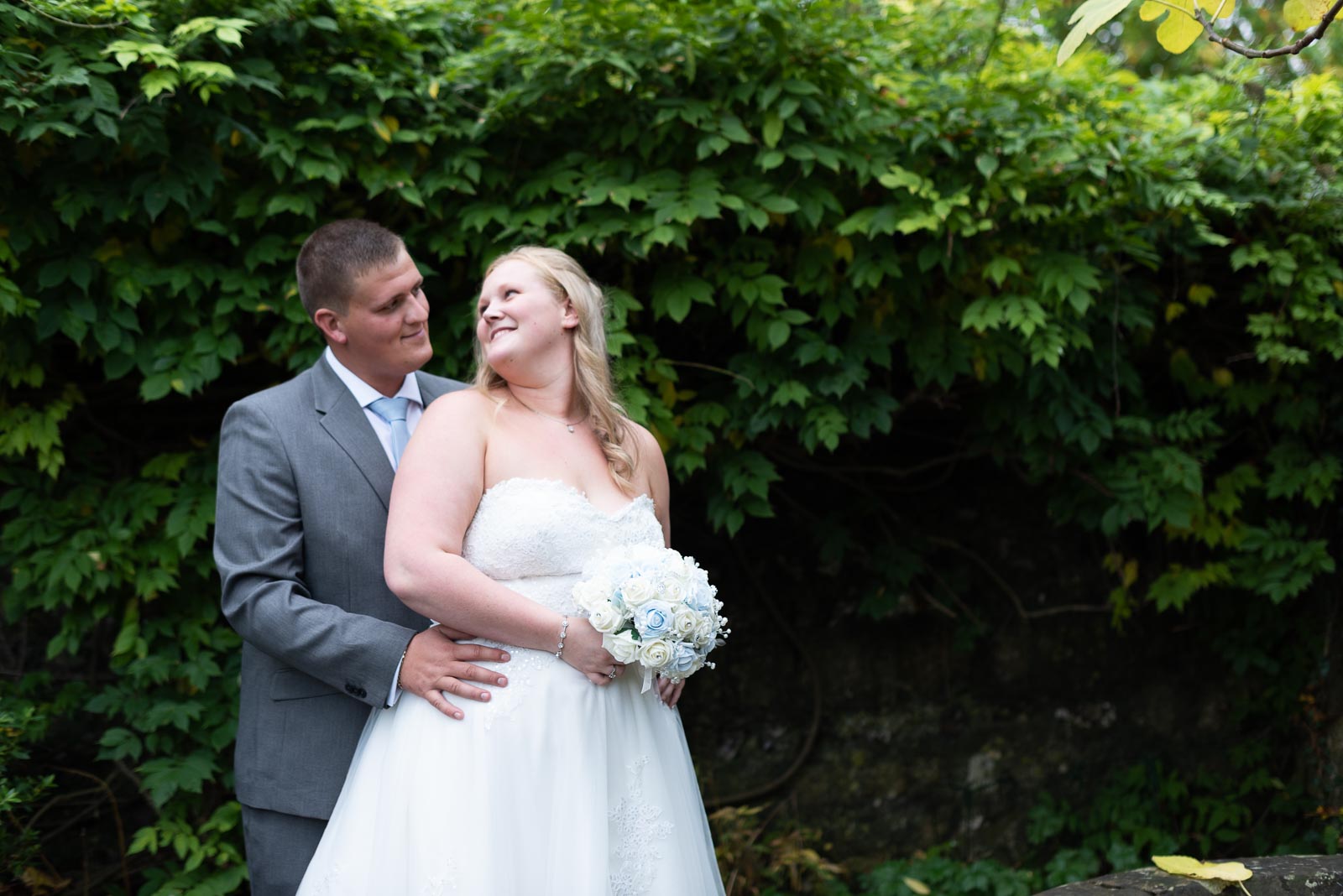 Eliana and Jacob enjoy a moment looking at eachother in Southover Grange after their wedding at Lewes Register Office.