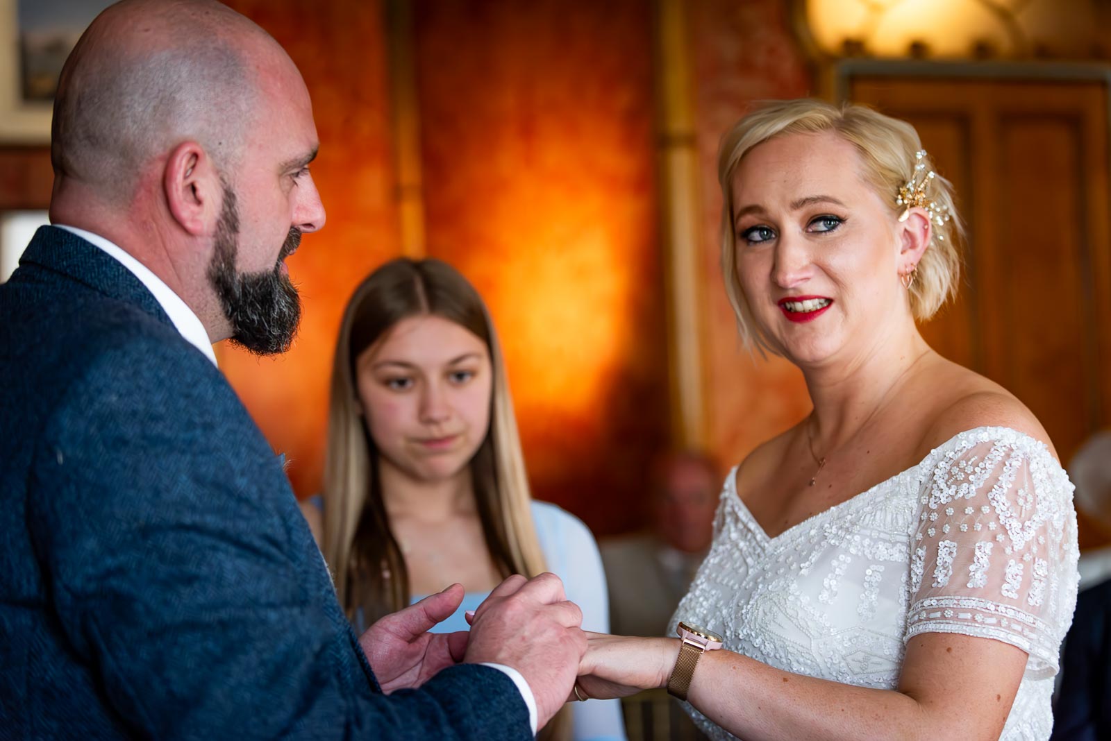 Georgina gives her vows during the exchanging of rings during her wedding to Andy at The Red Drawing Room in Brighton Royal Pavilion.